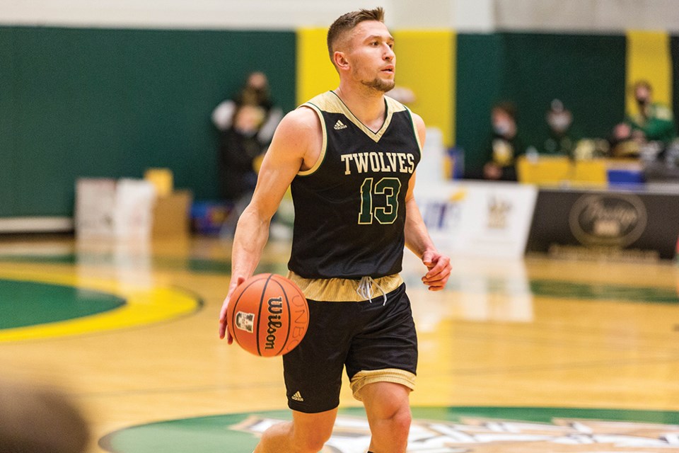 Citizen Photo by James Doyle. UNBC Timberwolves guard Vova Pluzhnikov moves the ball up the court against the Fraser Valley Cascades at Northern Sport Centre.