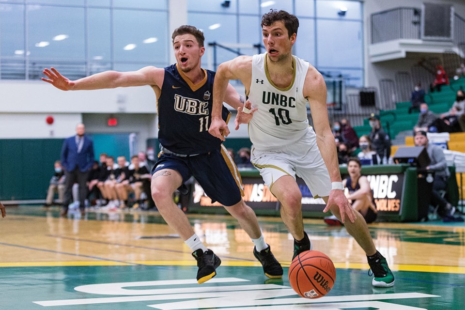 Citizen Photo by James Doyle. UNBC Timberwolves guard Chris Ross drives to the net against UBC Thunderbirds defender James Woods on Sunday afternoon at Northern Sport Centre in men's Canada West basketball action. The Thunderbirds defeated UNBC by a score of 93-74. 