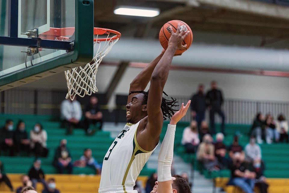 Citizen Photo by James Doyle. UNBC Timberwolves forward Fareed Shittu throws down a big slam dunk  against the Trinity Western Spartans on Saturday afternoon at Northern Sport Centre.