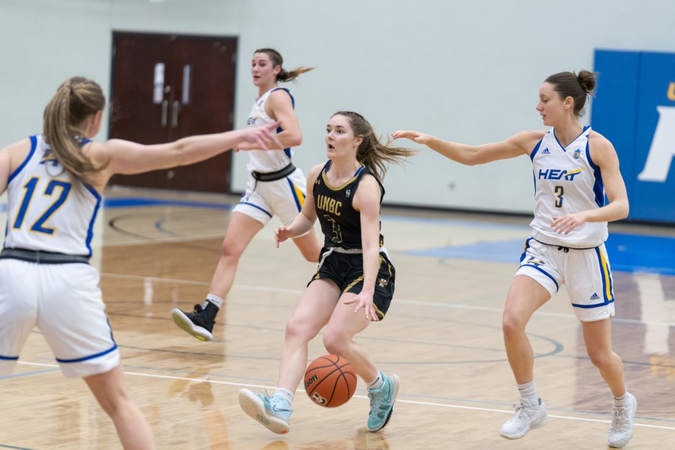 Sarah Kuklisin of te UNBC T-wolves dribbles into UBC-Okanagan Heat territory during their game Saturday in Kelowna.