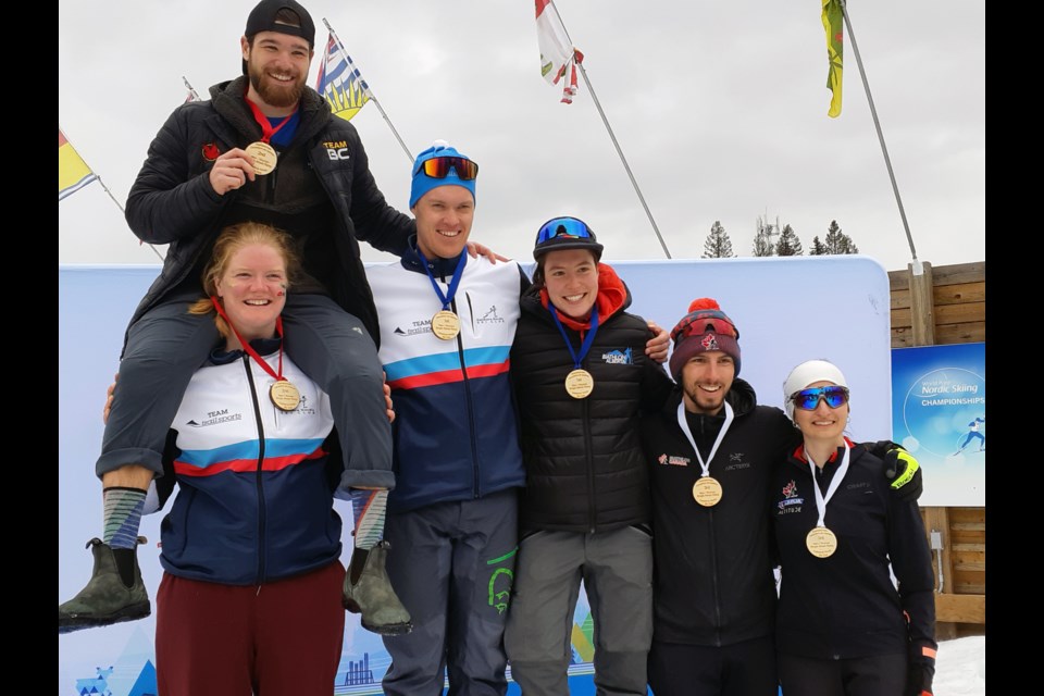 Medal winners from the senior single mixed relay gather for photo on the podium at the Canadian biathlon championships Thursday at Otway Nordic Centre.
From left are silver medalists Sarah Beaudry, with teamate Andrei Secu on her shoulders; gold medalists Aidan Millar and Megan Bankes; and bronze medalists Trevor Kiers and Zoe Pekos,