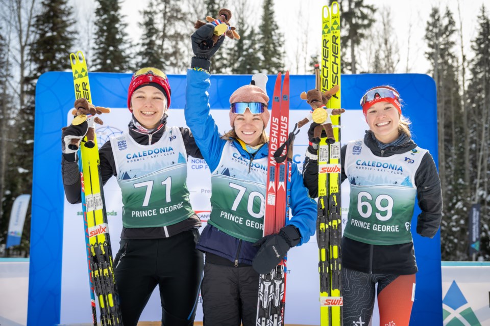 Natalie Wilkie of Samlon Arm, left, and Liudmyla Liashenko of Ukraine, centre, celebrate their shared gold medal win with bronze medalist Brittany Hudak of Saskatoon. Wilkie and Liashenko finished in a dead-heat with identical times in the women;s standing 7.5 km race at the Para Biathlon World Championships Wednesday at Otway Nordic Centre.