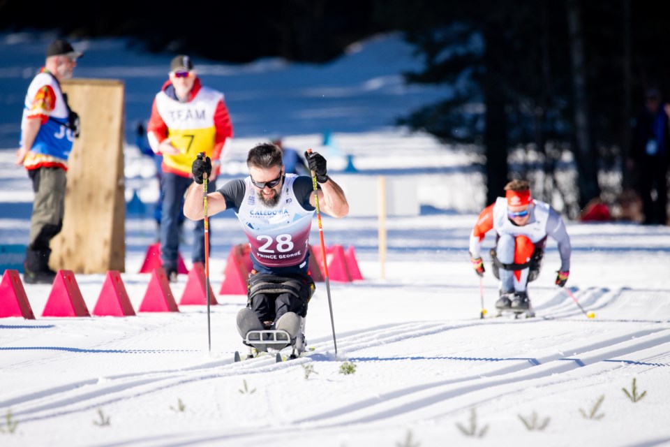 Silver medalist Collin Cameron reaches the finish ahead of Canadian teammate Derek Zaplotinsky in the Para Nordic World Cup Final men's sitting 20 km cross-country race Sunday at Otway Nordic Centre.