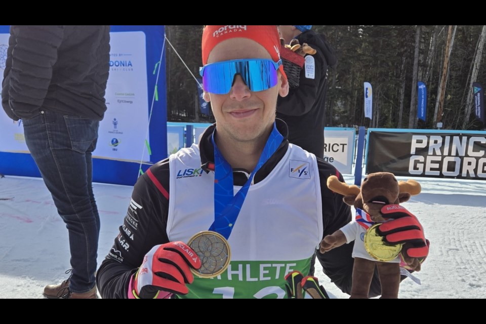 Derek Zaplotinsky of Smoky Lake, Alta., celebrates his win on the men's sitting class 5 km cross-country classic race Thursday at the Para Nordic World Cup Finals at Otway Nordic Centre.