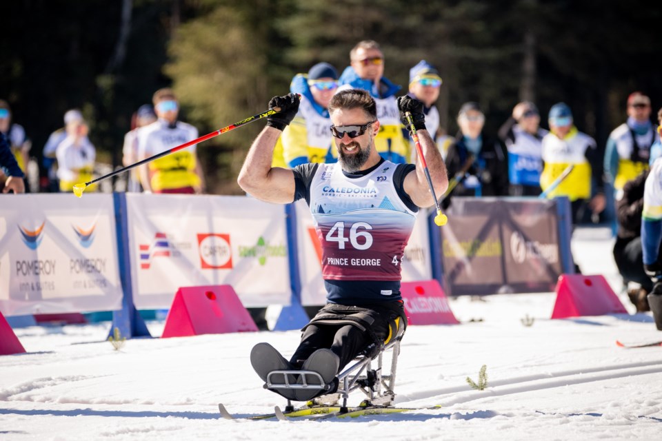 Collin Cameron of Bracebridge, Ont., celebrates his gold-medal win Saturday in the Para Nordic World Cup Finals men's sit-ski event at Otway Nordic Centre.