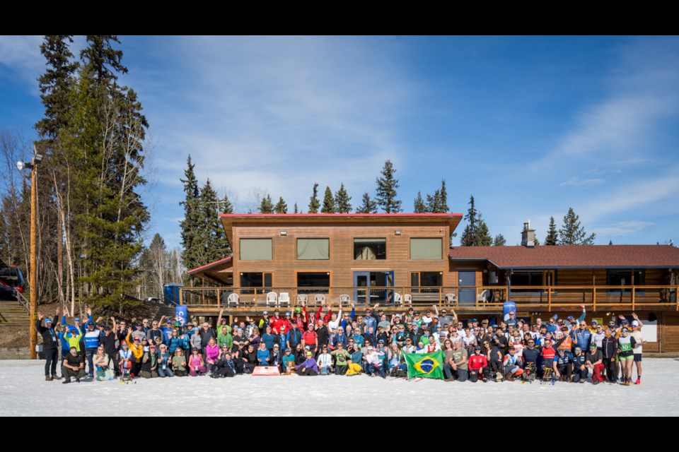 Skiers, coaches and officials gather for a group photo on Sunday, March 17, after two weeks of para nordic competition at Otway Nordic Centre.