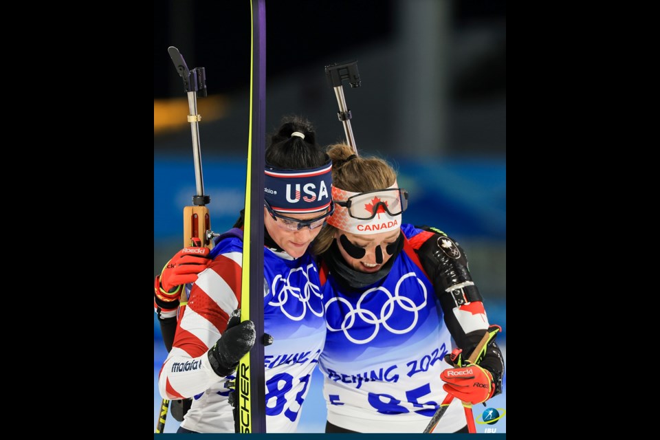 Burns Lake biathlete Emily Dickson, right, hugs Joanne Reid of Palo Alta, California after they competed in Monday's women's 15 km individual event at the Beijing Olympics. It was the first Olympic race of Dickson's biathlon career.
