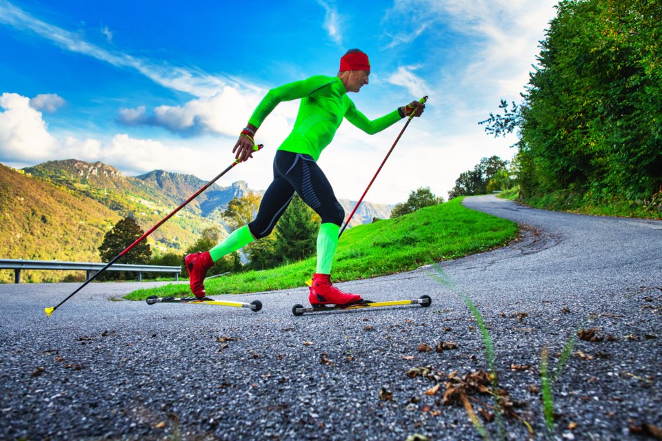 A classic skier heads up a hill on a roller ski trail. Caledona Nordic Ski Club has been selected for a $1 million grant that will pay for a two-kilometre asphalt trail at Otway Nordic Centre,