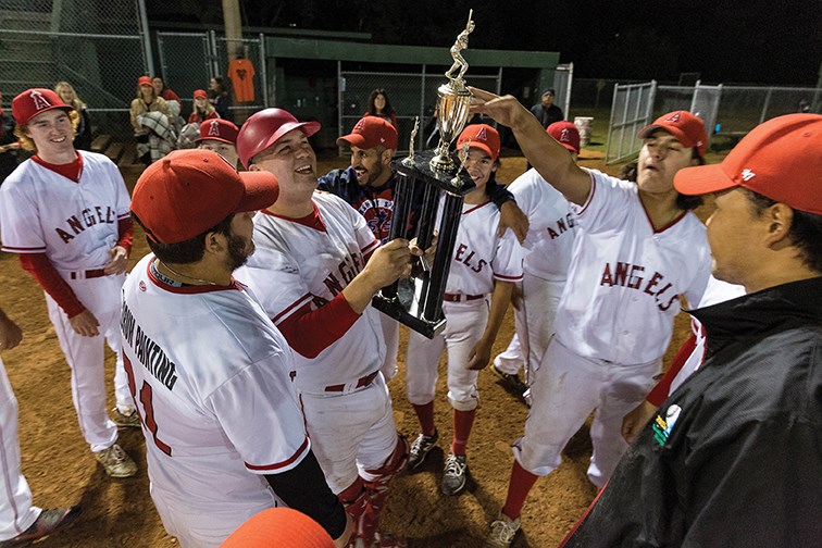 The Decorum Painting Angels celebrate on Thursday evening at Spruce City Stadium after defeating the LTN Contracting Reds 8-3 to win the Spruce City Men's Fastball Association championship.