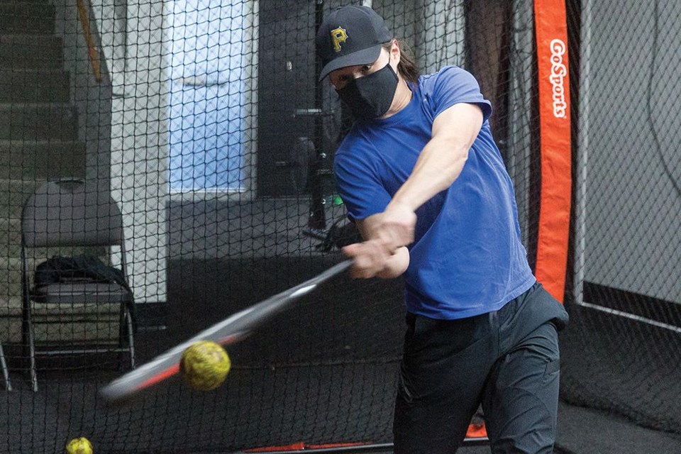 Nick Potskin cranks the ball during indoor batting at Northern Baseball Academy's Nicholson Street facility. 