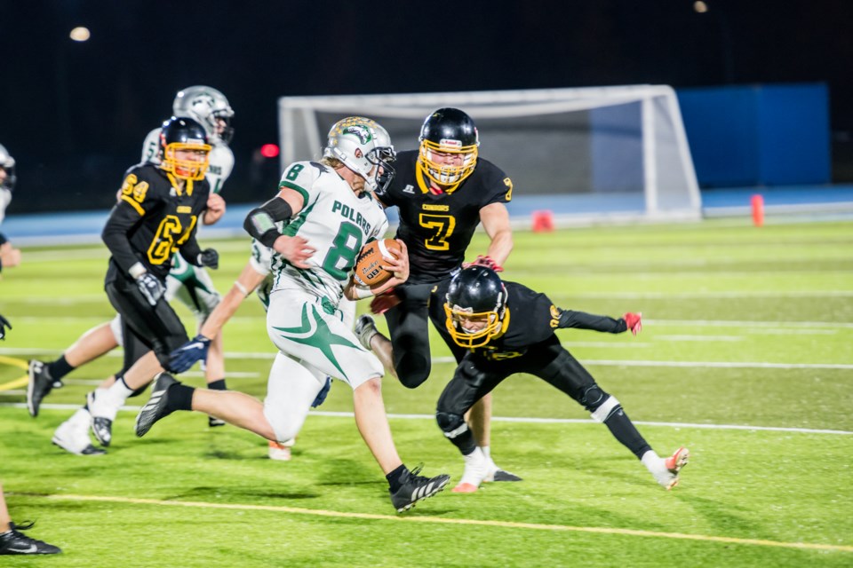 Prince George Polars quarterback Jason Kragt takes off with the ball during Friday's high school football regular-season finale against the Duchess Park Condors at Masich Place Stadium. The Polars won 26-20 to clinch first place.