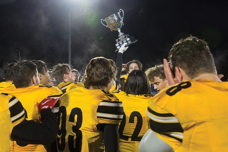 Citizen Photo by James Doyle/Local Journalism Initiative. The Duchess Park Condors hoist the Matt Pearce Memorial Cup after defeating the PGSS Polars to win the PG Bowl on Friday night at Masich Place Stadium. 