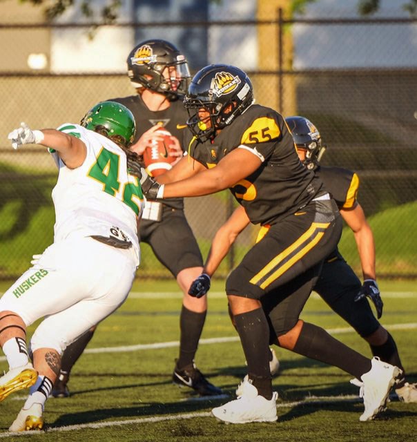 Prince George Kodiaks quarterback Liam Oczkowski eyes his target while lineman Miceal Astone tries to hold off Valley Huskers linebacker Brandon Duncan during Saturday's BCJFC game in Chilliwack. The Huskers went on to win 31-5.