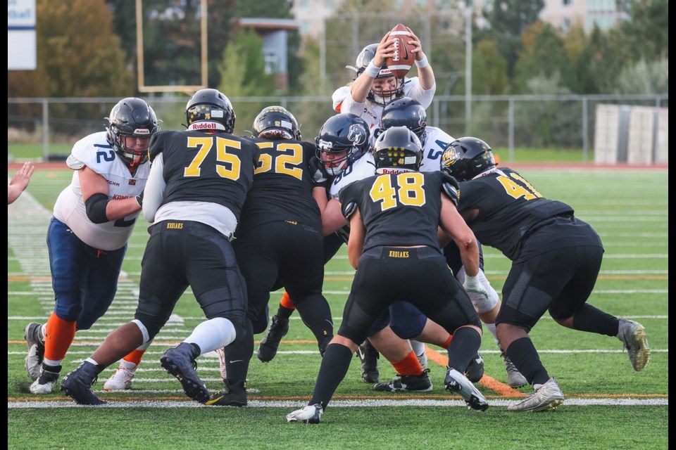 The Prince George Kodiaks converge on Kamloops Broncos quarterback Reid Vankoughnett during their BCFC game last Saturday in Kamloops. The teams meet again this Saturday at Masich Place Stadium.