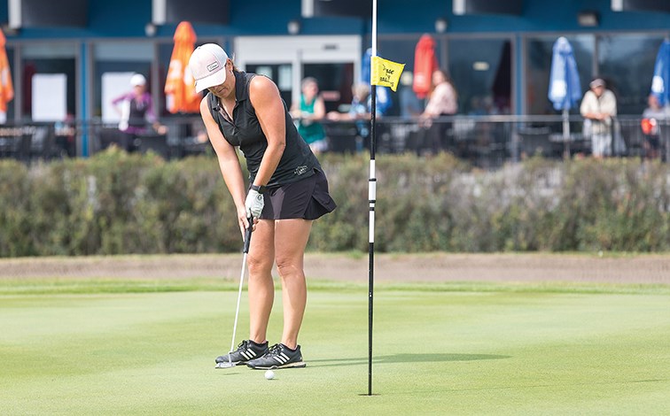 Lisa Kerley seals her win with a putt on the 18th green Sunday afternoon at Prince George Golf and Curling Club while playing in the 54th Ladies Simon Fraser Open. 