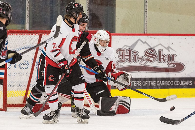Citizen Photo by James Doyle/Local Journalism Initiative. Cariboo Cougars goaltender Tysen Smith keeps a close eye on the puck after a shot on goal from the Okanagan Rockets on Sunday morning in Kin 1. The Cougars went on to win the game by a score of 4-2.