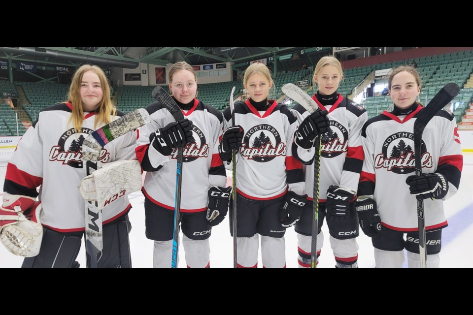 The PGMHA U15 Capitals female rep hockey team includes two sets of twins and five siblings from two families. From left are Alex Boal, Sydney Boal, Eve Naegeli, Lily Naegeli and Addison Boal.