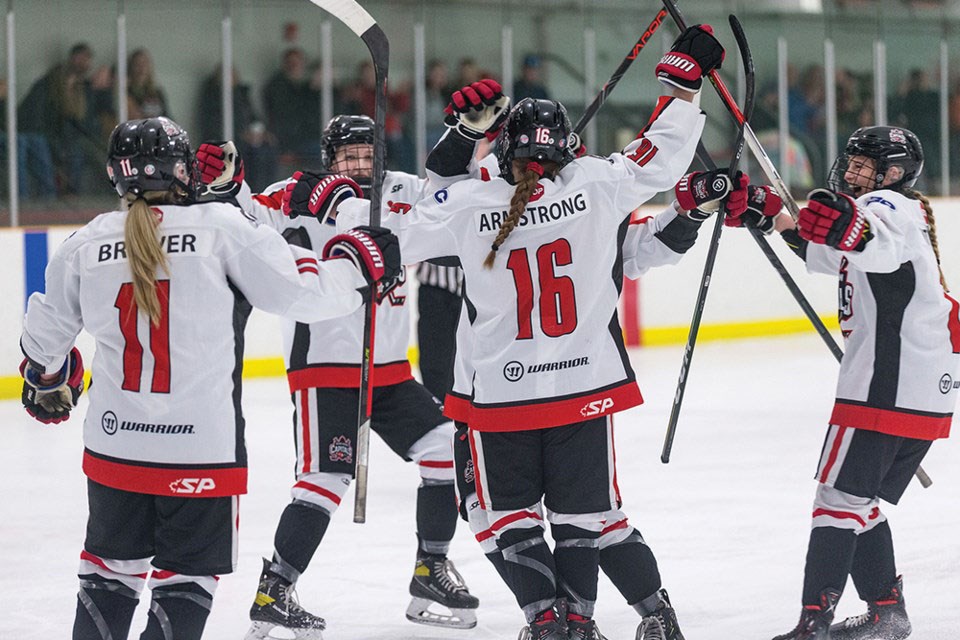 The Northern Capitals celebrate a goal during their BC Elite Hockey League semifinal series at Kin 2 against the Vancouver Island Seals. Caps forward Hailey Armstrong and defender Ella Boon have been name to the league all-star team.