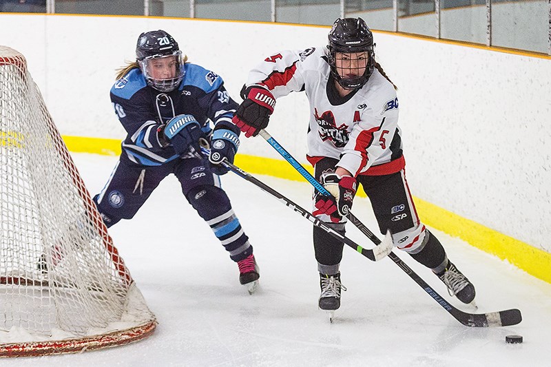  Northern Capitals forward Maria Arye makes a play with puck behind the net against Thompson-Okanagan Lakers defender Kadence Mollin on Sunday morning in Kin 2. The Capitals went on to win the B C Elite Hockey League U-18 female divison game 3-2.
Citizen Photo by James Doyle/Local Journalism Initiative.