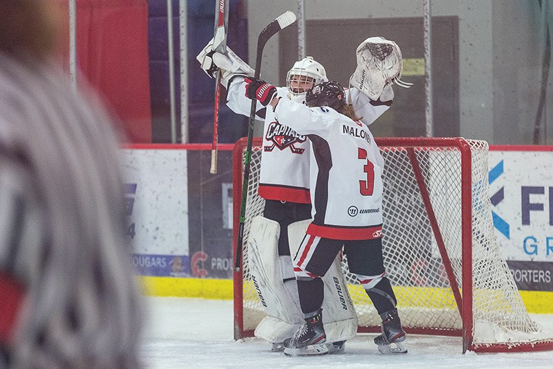 Citizen Photo by James Doyle. Northern Capitals goaltender Sierra Eagles celebrates her win with teammate Avery Maloney after defeating the Thompson-Okanagan Lakers on Sunday morning in Kin 1 during BCEHL Female U18AAA action.