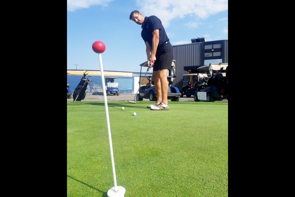 Former Cougar defenceman Dan Gibb practices his putting before going out on the course for the Cougars Alumni golf tournament Saturday at Prince George Golf and Curling Club.