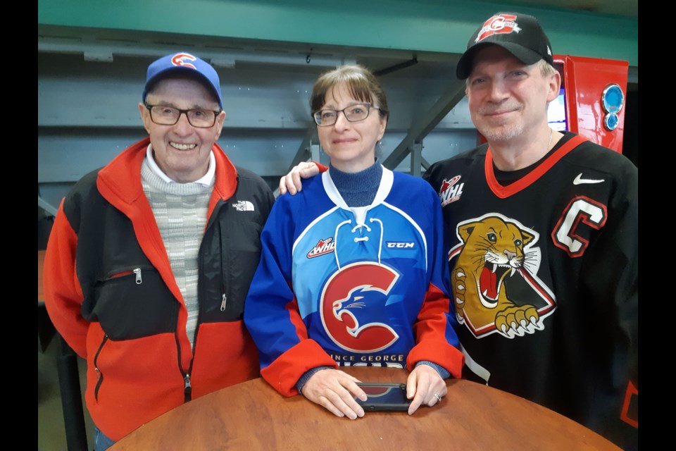 Longtime Prince George Cougars season-ticket holders, from left, Lorne Allen, Vickie Lein and Larry Lein, got together one last time this season during the intermission break between periods at Wednesday's playoff game at CN Centre against the Portland Winterhawks. The Cougars lost 2-1 and were swept out of the WHL playoffs.