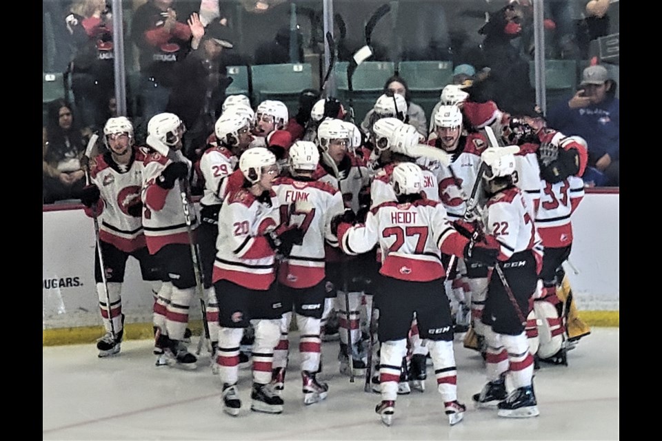 The Cougars celebrate their series-clinching 5-4 victory over the Tri-City Americans Sunday night at CN Centre. 