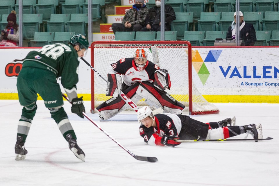 Everett Silvertips winger Niko Huuhtanen gets set to unload on goalie Tyler Brennan while Cougars defenceman Jaren Brinson is caught dangerously close to shooting range.