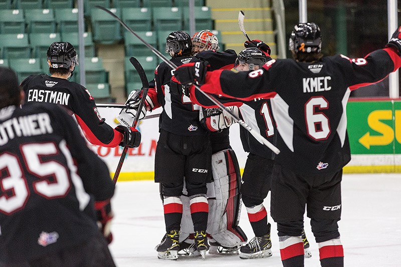 Citizen Photo by James Doyle/Local Journalism Initiative. Prince George Cougars goaltender Tyler Brennan is mobbed by his teammates after earning his first shut-out of the season in a 4-0 win against the Victoria Royals on Wednesday night at CN Centre.