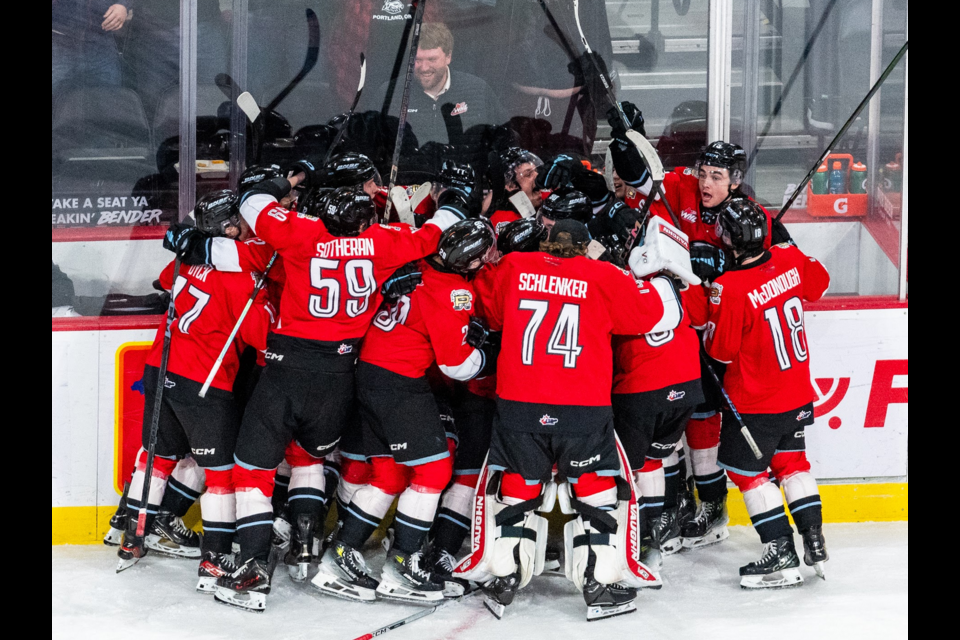 The Portland Winterhawks celebrate their 5-4 double-overtime win over the Prince George Cougars on Wednesday, April 2, 2025 in Portland, Ore., in Game 4 of the WHL Western Conference quarterfinal series.
