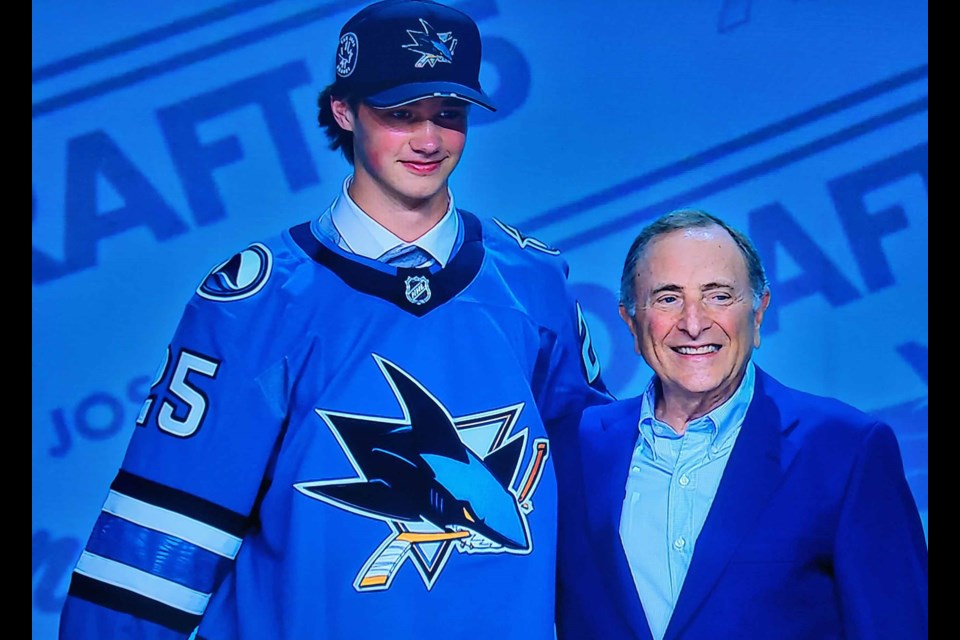 Prince George Cougars goalie Joshua Ravensbergen shares the stage with NHL commissioner Gary Bettman after he was picked 30th overall in the NHL draft Friday, June 27, 2025 in Los Angeles.