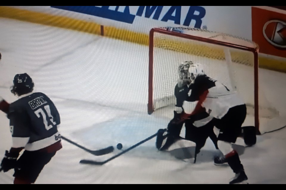 Cougars defenceman Ethan Samson lifts the rebound into the Vancouver Giants net to score the overtime winner, 1:58 into OT Friday night in Langley.