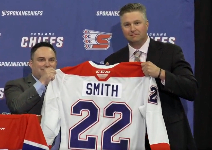 Ryan Smith is introduced by general manager Matt Bardsley as head coach of the Spokane Chiefs in July 2022.