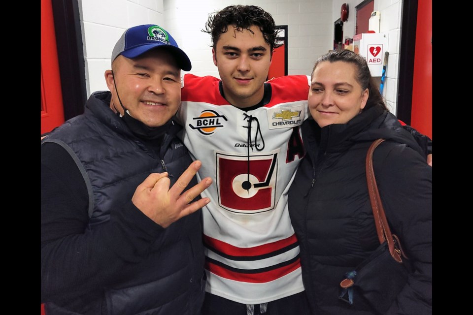 Merritt Centennials centre Ben Ward gets a hug from his parents, Ken and Jill, after he scored three goals, including the overtime winner in the Cents' 4-3 win over  the Wenatchee Wild Friday night in Merritt. It was the Cents' first win in 15 games this season and it came at good time for a city that's been forced to deal with a disastrous flood over the past three weeks.