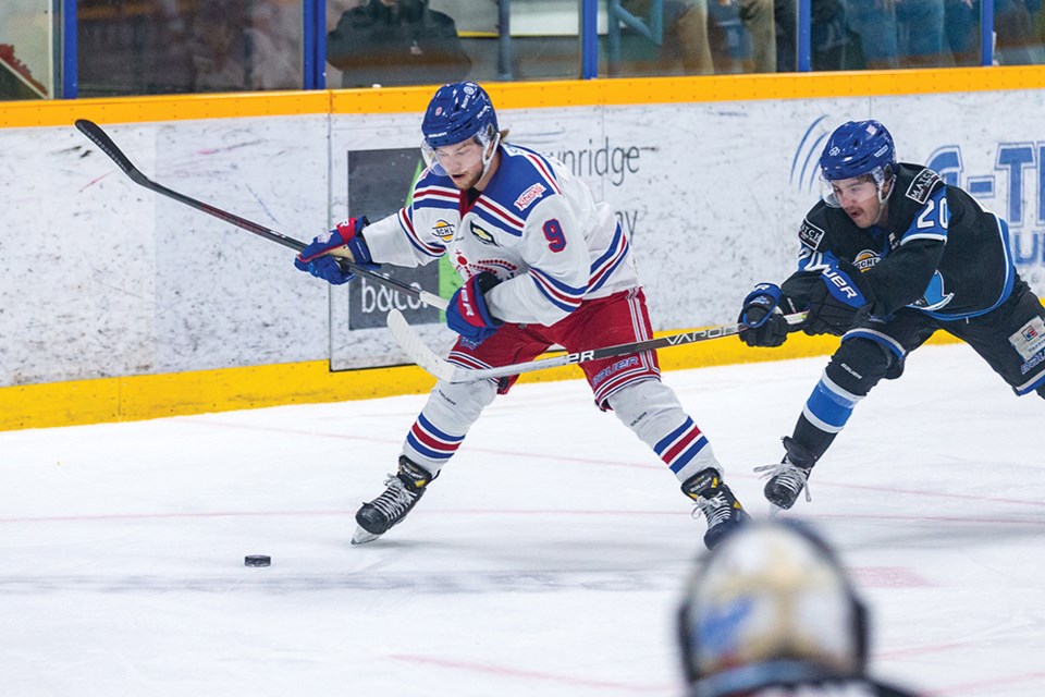 Citizen Photo by James Doyle. Prince George Spruce Kings forward Luc Laylin tries to get a shot off against Penticton Vees foward Josh Nadeau on Monday night at Rolling Mix Concrete Arena. 