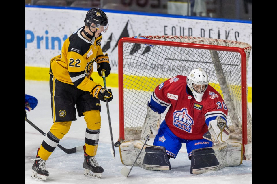 Victoria Grizzlies Malcolm Green tips the puck in front of Prince George Spruce Kings goaltender Colin Reay in BCHL action at The Q Centre in Victoria.