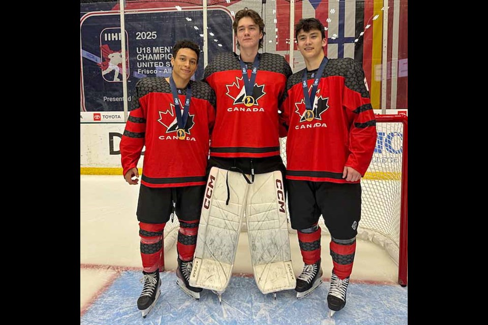 Prince George native Cameron Schmidt, left, poses with his Vancouver Giant teammates, goalie Burke Hood and defenceman Ryan Lin on Saturday, May 3, 2025, after they defeated Sweden 7-0 in the gold-medal final at the IIHF Men's U18 World Championship in Frisco, Texas.