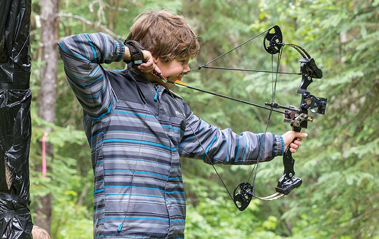 Nine-year-old Kalem Schultz draws back his bow and gets a 3-D target in his sights on Saturday morning at Keith Paterson Field at the Silvertip Archers outdoor facility on Highway 16 East while particpating in the Silvertip Archers Outdoor 3-D competition. Approximately 100 people took part in the weekend event with archers coming from all over B.C., including Prince George, Vanderhoof, Quesnel, Maple Ridge, and Vernon.