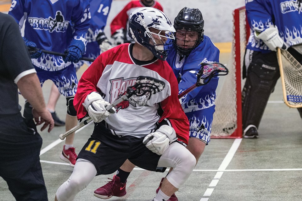 Citizen Photo by James Doyle. The BHL Bandits (red) took on the Quesnel Crossfire (blue) on Wednesday night at the Prince George Coliseum in the Prince George Senior Lacrosse League season opener.