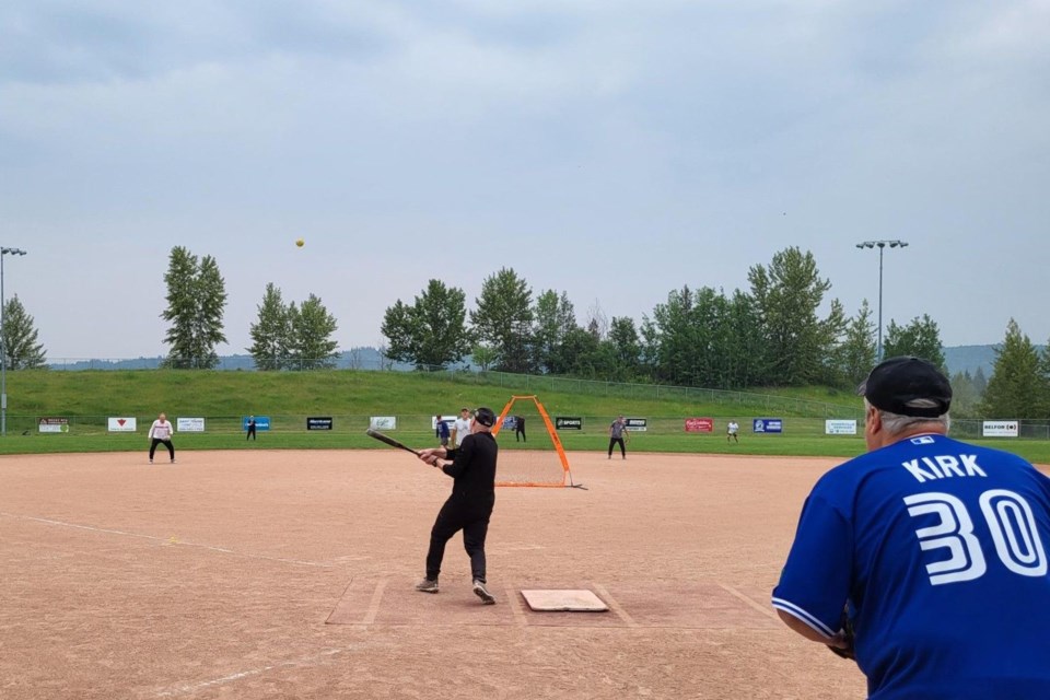 Making contact during the Masters Mixed Slopitch League game at Nechako Park Field on Thursday, June 12, 2025. Organizers are looking for new players to grow the league.