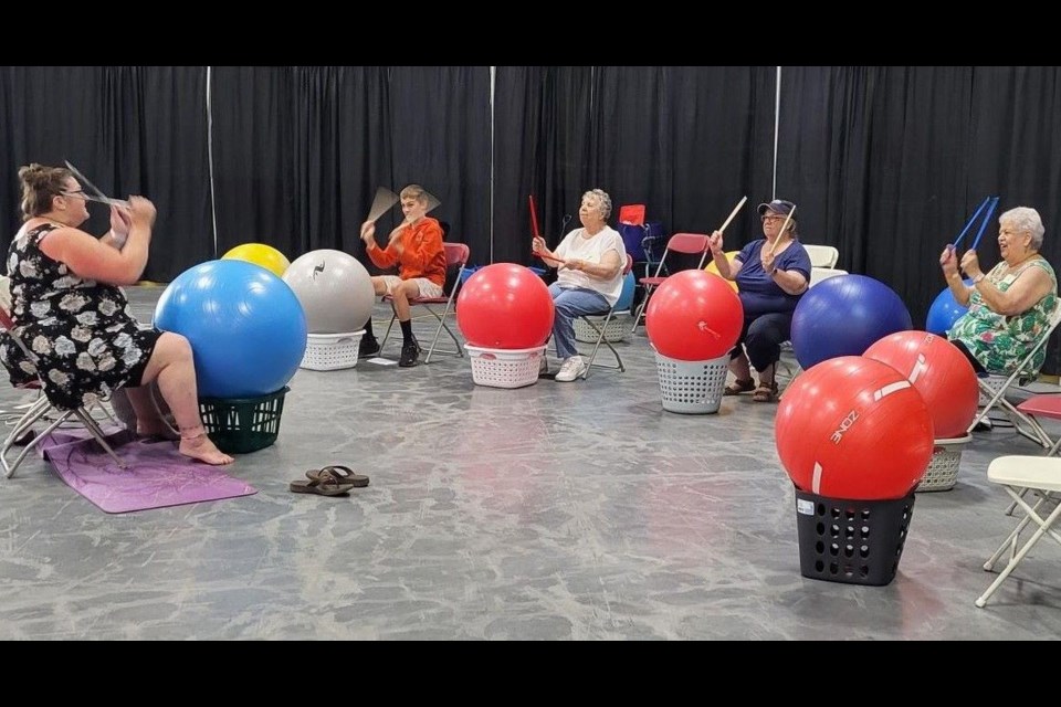 Shirley Morin, left, leads the Cardio Drumming demonstration at the BCNE Seniors Fair last summer where enthusiastic people joined in the fun.