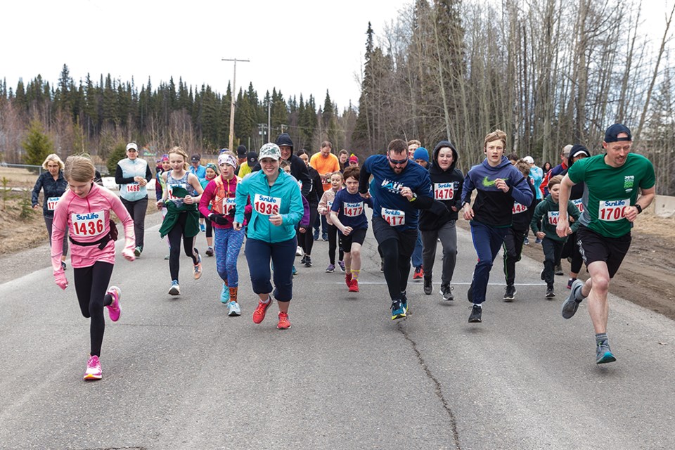 Citizen Photo by James Doyle. Runners take off from the starting line on Sunday morning while competing in the 5 km route of the Prince George Road Runners Hart Half.