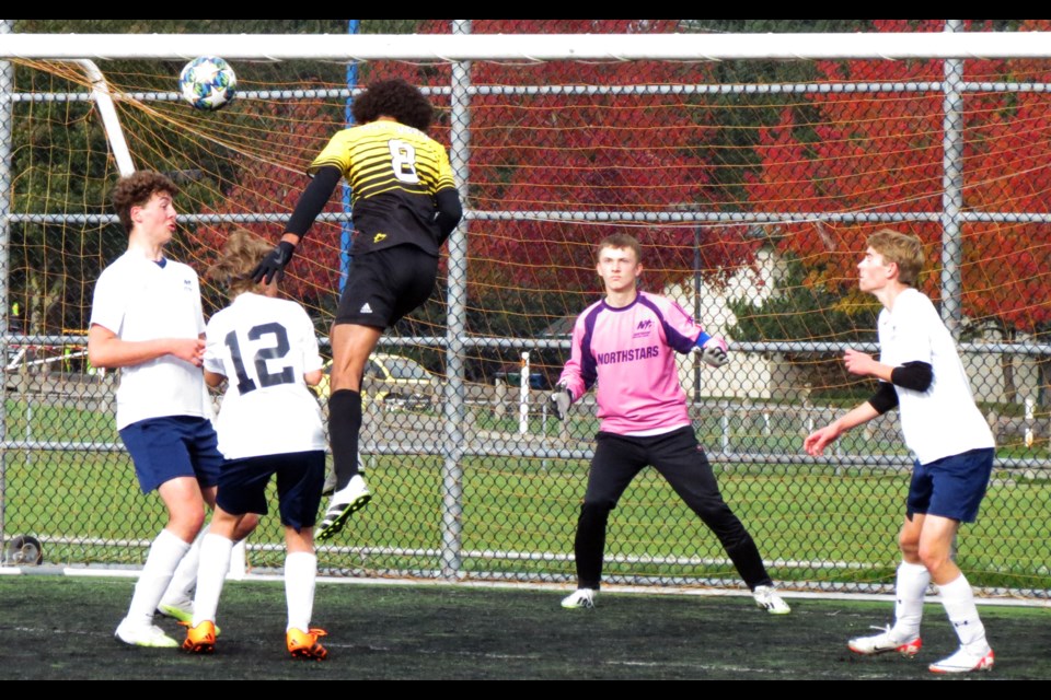 Northside North Stars goalie Sam Klassen, shown in action against Ecole Jules Verne in the bronze- medal game at the 2023 single-A boys soccer championship last weekend in Aldergrove, was picked as the top goaltender at the 16-team tournament. Helping him out in the crease are, from left, teammates David Wiens, Graham Yoder and Dietrich Pelzer. 