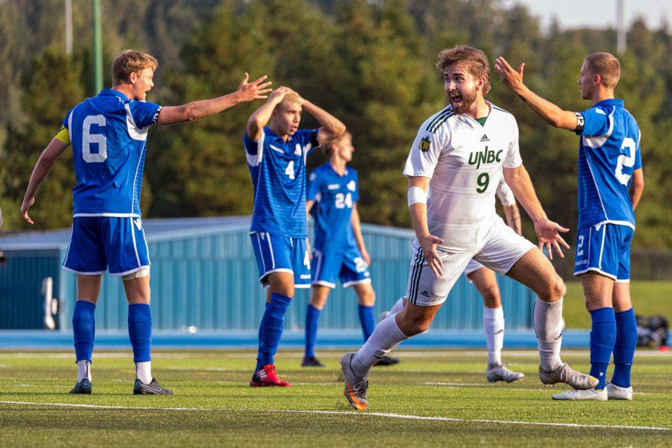 UNBC Timberwolves striker Michael Henman celebrates his third goal of the game during a Sept. 2 Canada West men's soccer game at Masich Stadium. Henman scored three of his team's goals in a 4-1 victory.