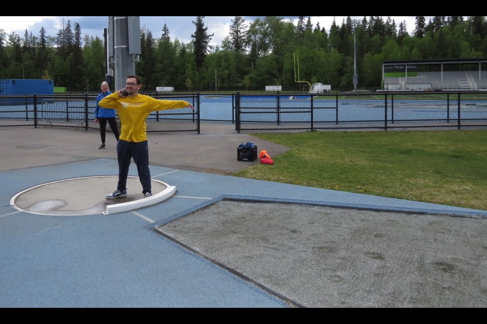 Spencer Rourke, Special Olympics athlete, will be competing in the BC Summer Games in Track & Field held in Prince George at Masich Place from July 10-12. Here Spencer fine tunes his shot put technique as Head Coach Wilma VanHage looks on at practice on Wednesday, May 21, 2025.