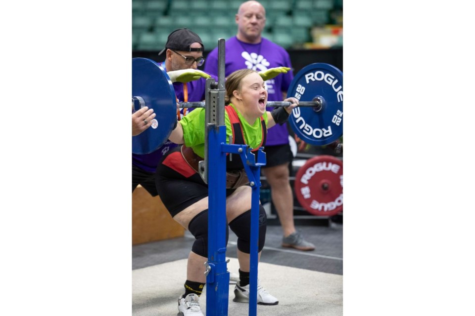 Meliah Motchman, powerlifter from Victoria, prepares to do her squat during the Special Olympics BC Summer Games held in Prince George from July 10 to 12. Here Meliah makes her successful attempt with an enthusiastic shout at CN Centre on July 11, 2025.