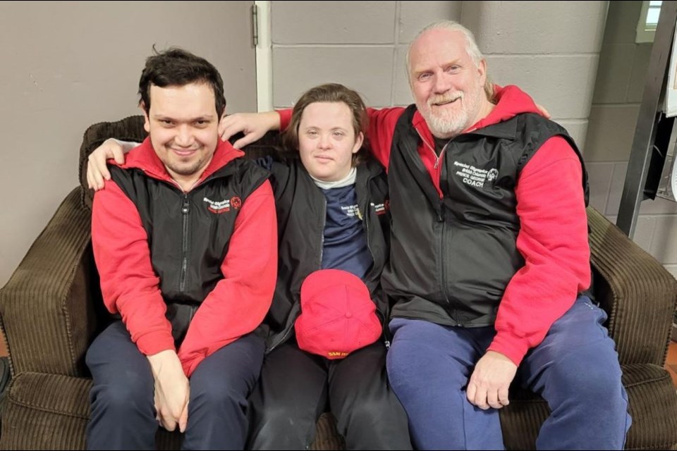 Spencer Rourke, left, and Sam Russell, are Special Olympics curlers heading to Nationals on Feb. 27 are seen here with training coach Peter Goudal before practice at the Prince George Golf and Curling Club.