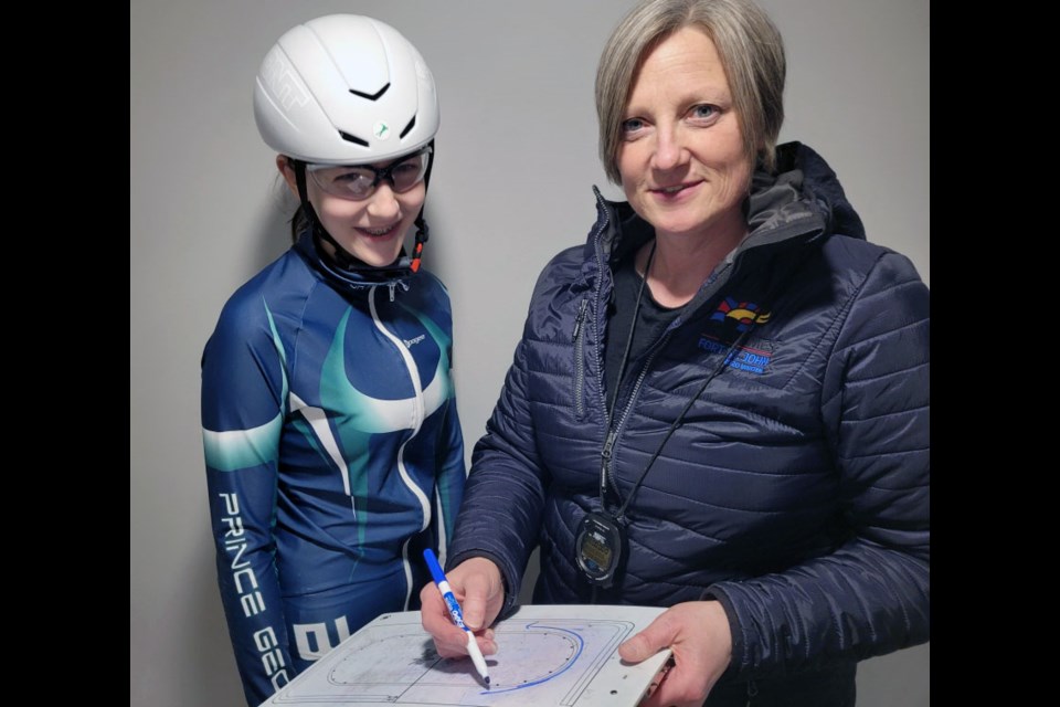 Prince George Blizzard Speed Skating Club coach Taryn Vansickle discusses a racing strategy with her daughter Megan. Vansickle was chose as viaSport's community coach of the year for 2022.