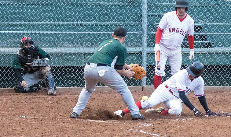 Citizen Photo by James Doyle/Local Journalism Initiative. The FFR Glass Grays (green) took on the Decorum Painting Angels (white) on Monday evening at Spruce City Stadium during opening night of the Spruce City Men's Fastball League.