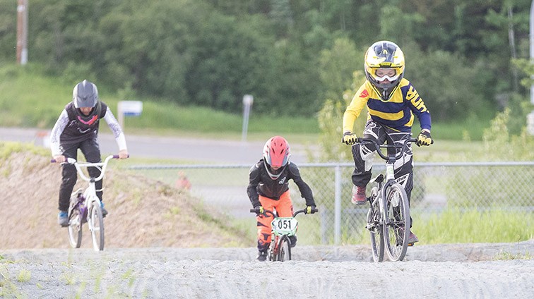 Citizen Photo by James Doyle/Local Journalism Initiative. Riders make their way around the Supertrak BMX track on Thursday evening during the first practice of the season.